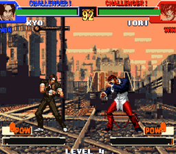 Kyo and Iori facing each other on a rooftop stage